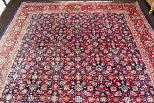 A superb large (4m x 3m) Iranian Tabriz "Afshan" Persian carpet in rich reds, blues and earthy tones