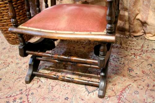 A lovely vintage Imbuia Victorian styled platform rocking chair with dusty pink upholstery.