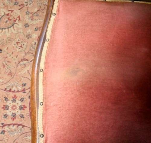 A lovely vintage Imbuia Victorian styled platform rocking chair with dusty pink upholstery.