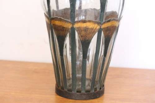 An extremely rare hand blown "caged" glass vase with a handmade & painted metal papyrus cage
