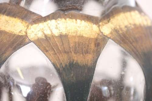 An extremely rare hand blown "caged" glass vase with a handmade & painted metal papyrus cage