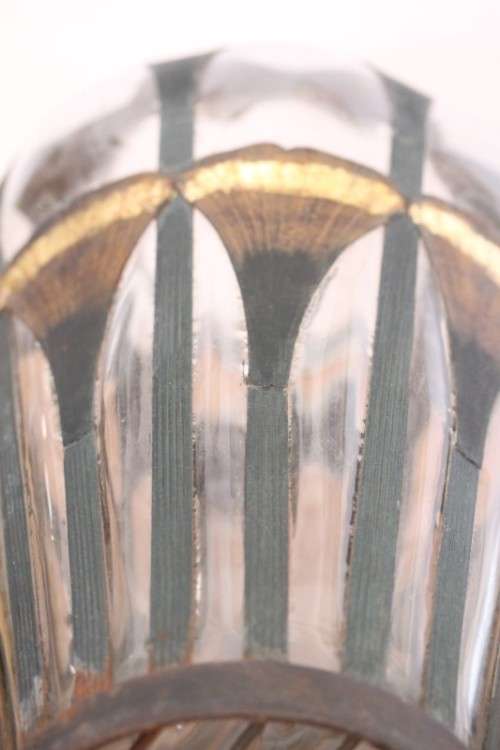 An extremely rare hand blown "caged" glass vase with a handmade & painted metal papyrus cage