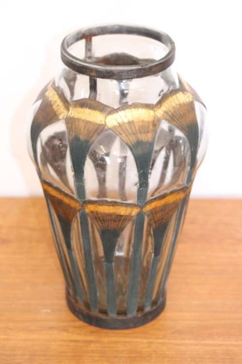 An extremely rare hand blown "caged" glass vase with a handmade & painted metal papyrus cage