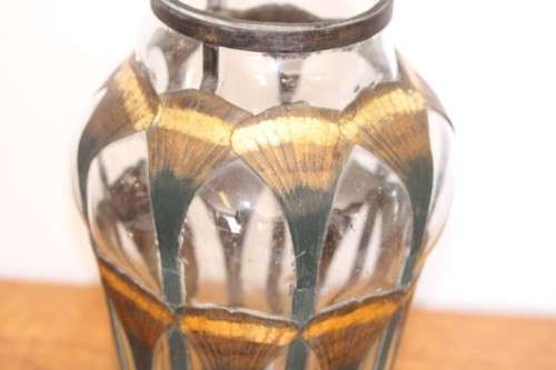 An extremely rare hand blown "caged" glass vase with a handmade & painted metal papyrus cage