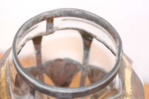 An extremely rare hand blown "caged" glass vase with a handmade & painted metal papyrus cage