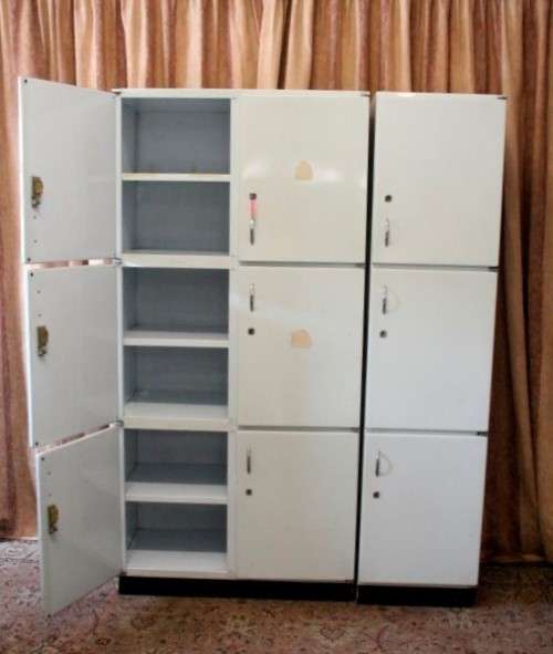 A fantastic large 6 door metal kitchen cabinet w/ loads of shelving space & a 2 door broom cupboard