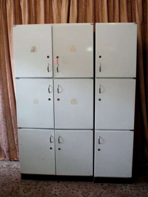 A fantastic large 6 door metal kitchen cabinet w/ loads of shelving space & a 2 door broom cupboard