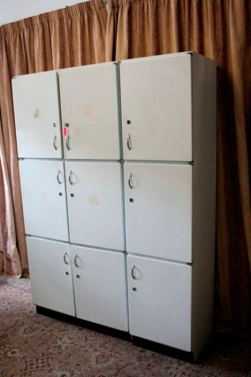 A fantastic large 6 door metal kitchen cabinet w/ loads of shelving space & a 2 door broom cupboard