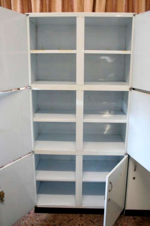 A fantastic large 6 door metal kitchen cabinet w/ loads of shelving space & a 2 door broom cupboard