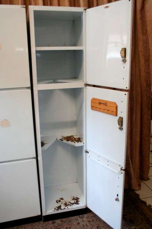 A fantastic large 6 door metal kitchen cabinet w/ loads of shelving space & a 2 door broom cupboard