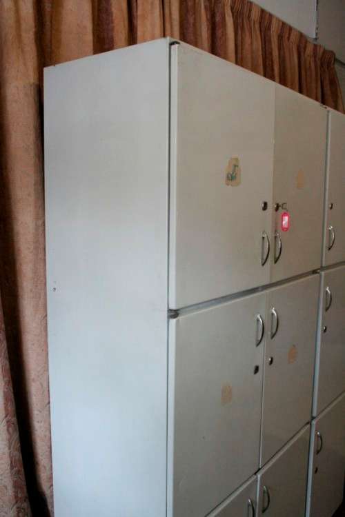 A fantastic large 6 door metal kitchen cabinet w/ loads of shelving space & a 2 door broom cupboard