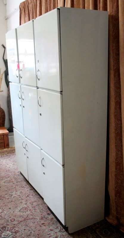 A fantastic large 6 door metal kitchen cabinet w/ loads of shelving space & a 2 door broom cupboard