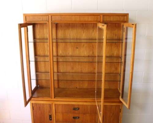 **RS17** A tall 3-door oak display cabinet with lighting, four drawers and two storage cupboards