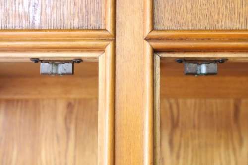 **RS17** A tall 3-door oak display cabinet with lighting, four drawers and two storage cupboards