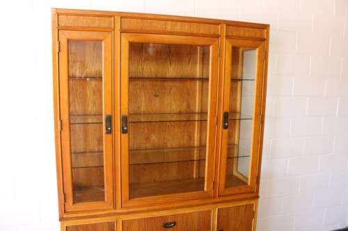 **RS17** A tall 3-door oak display cabinet with lighting, four drawers and two storage cupboards