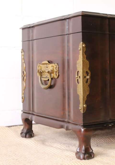 Gorgeous & solidly built solid stinkwood ball & claw kist w/ a smalls shelf & brass embellishments