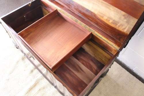 Gorgeous & solidly built solid stinkwood ball & claw kist w/ a smalls shelf & brass embellishments