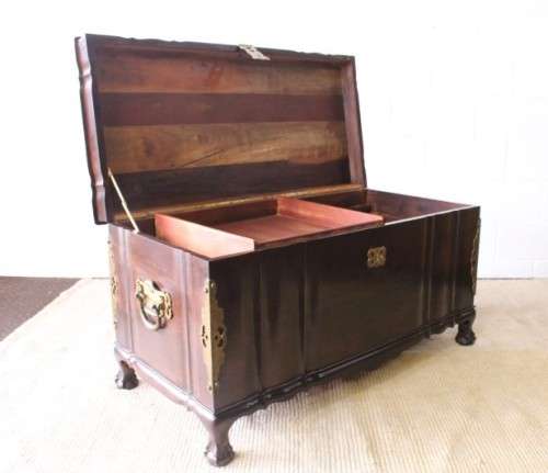 Gorgeous & solidly built solid stinkwood ball & claw kist w/ a smalls shelf & brass embellishments
