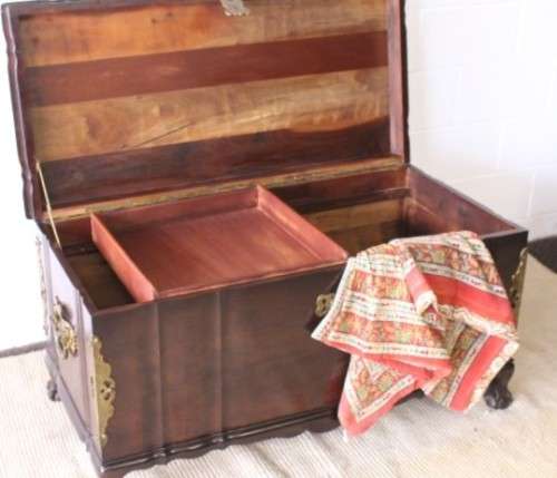 Gorgeous & solidly built solid stinkwood ball & claw kist w/ a smalls shelf & brass embellishments