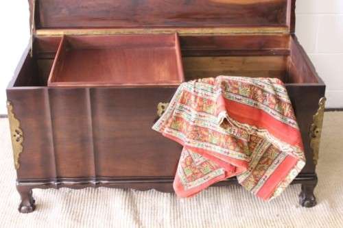Gorgeous & solidly built solid stinkwood ball & claw kist w/ a smalls shelf & brass embellishments