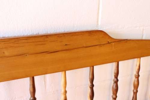A beautifully made solid yellowwood two-seater riempie bench with two gold cushions