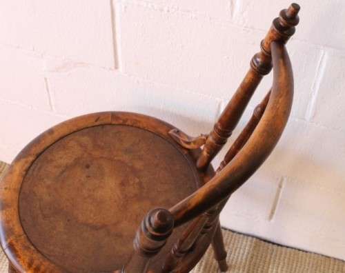 A stunning antique spindle-back occasional chair w/ a round seat and gorgeous turned legs & supports