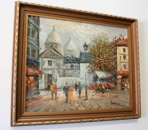 A beautiful original signed and framed "Burnett" oil painting of a village scene.