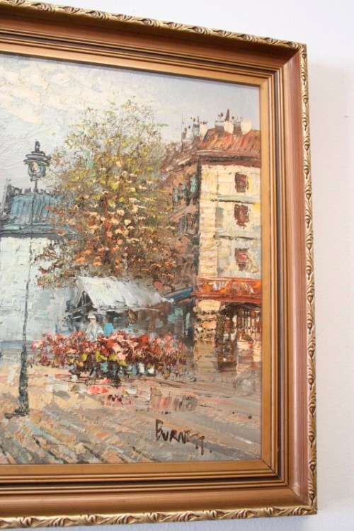 A beautiful original signed and framed "Burnett" oil painting of a village scene.