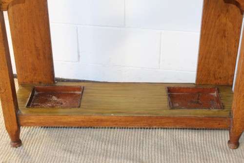 An incredible solid Oak hall stand with a bevelled mirror, drawer and six hooks for hats and coats!