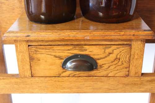 An incredible solid Oak hall stand with a bevelled mirror, drawer and six hooks for hats and coats!