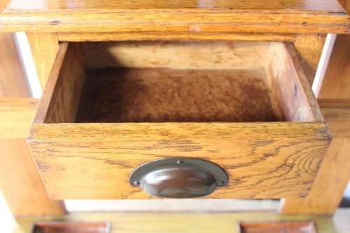 An incredible solid Oak hall stand with a bevelled mirror, drawer and six hooks for hats and coats!