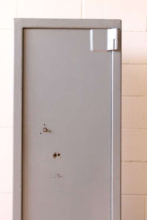 A larger, solidly made (1.46m tall) 8-rifle safe with four hand-gun and ammunition shelves