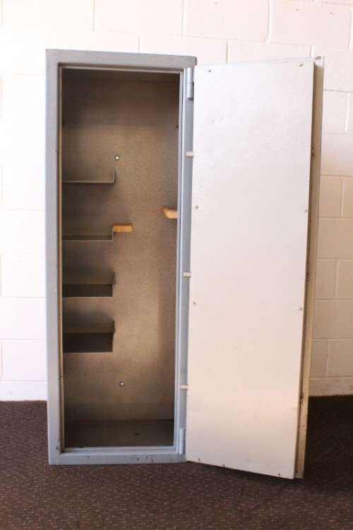 A larger, solidly made (1.46m tall) 8-rifle safe with four hand-gun and ammunition shelves