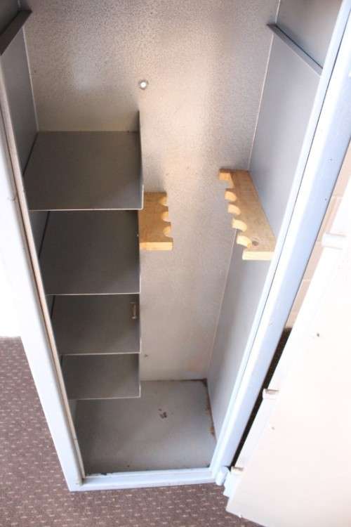 A larger, solidly made (1.46m tall) 8-rifle safe with four hand-gun and ammunition shelves