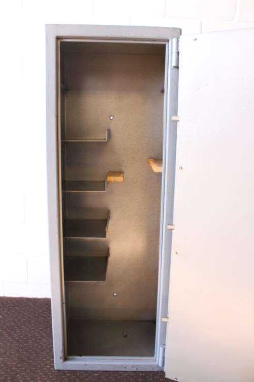 A larger, solidly made (1.46m tall) 8-rifle safe with four hand-gun and ammunition shelves