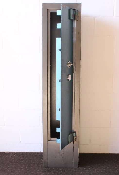 A solidly made (1.55m tall) National Safe Co 8-rifle safe with hand-gun & ammunition shelves