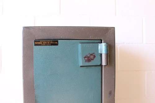 A solidly made (1.55m tall) National Safe Co 8-rifle safe with hand-gun & ammunition shelves