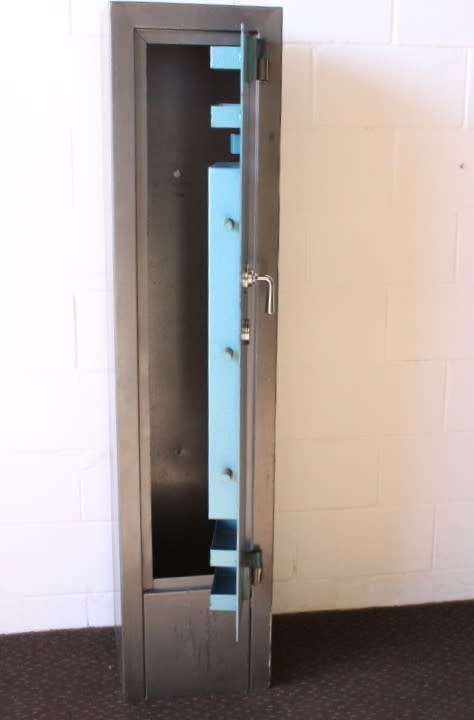 A solidly made (1.55m tall) National Safe Co 8-rifle safe with hand-gun & ammunition shelves