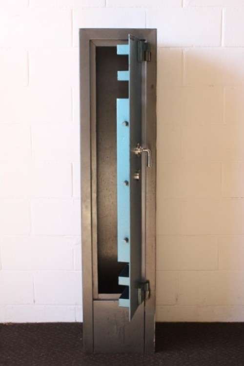 A solidly made (1.55m tall) National Safe Co 8-rifle safe with hand-gun & ammunition shelves