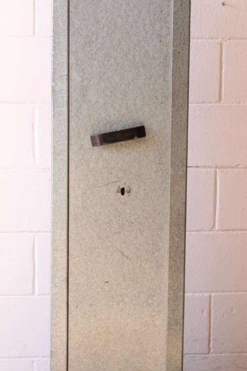 A well made 1.3m tall 4-rifle steel safe with a hand-gun/ ammunition/ key shelf