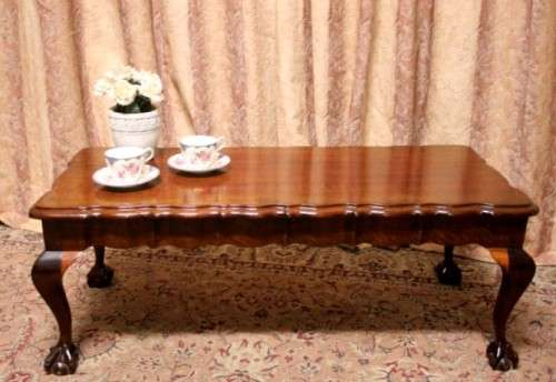 A  beautiful vintage solid Imbuia ball and claw centre coffee table.