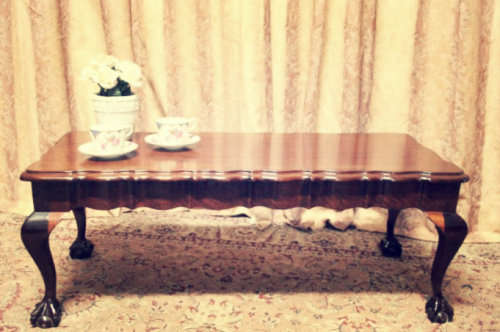 A  beautiful vintage solid Imbuia ball and claw centre coffee table.