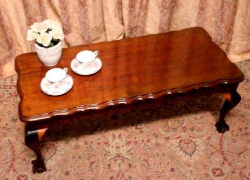 A  beautiful vintage solid Imbuia ball and claw centre coffee table.