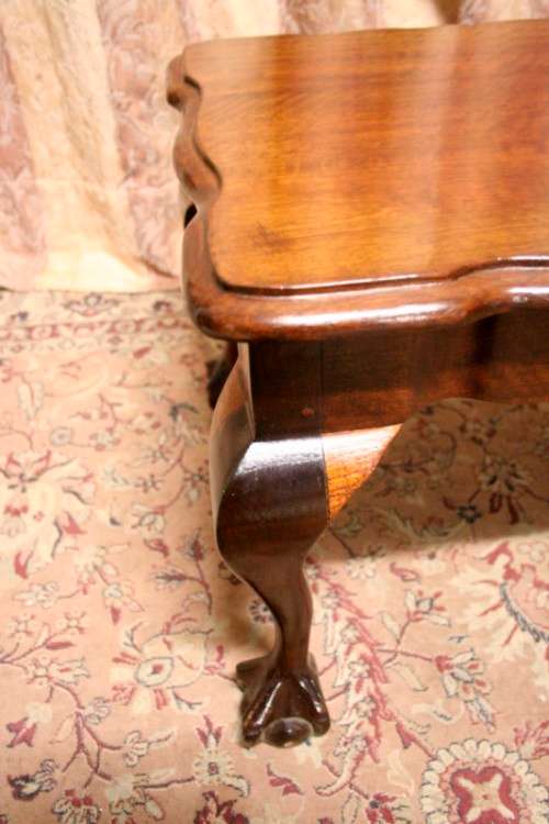 A  beautiful vintage solid Imbuia ball and claw centre coffee table.