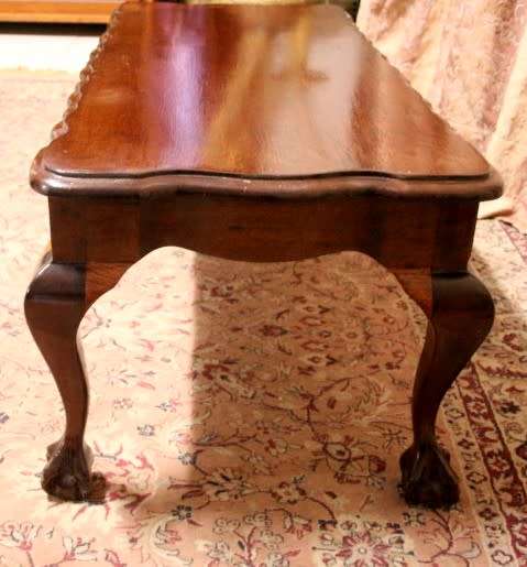 A  beautiful vintage solid Imbuia ball and claw centre coffee table.