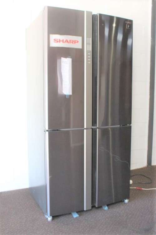 A fantastic silver front Sharp (Model SJ FP85V-BK5) 605 litre side-by-side fridge-freezer