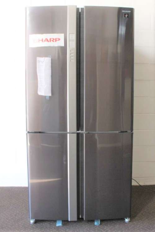 A fantastic silver front Sharp (Model SJ FP85V-BK5) 605 litre side-by-side fridge-freezer