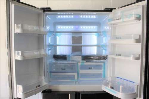 A fantastic silver front Sharp (Model SJ FP85V-BK5) 605 litre side-by-side fridge-freezer
