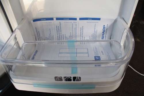 A fantastic silver front Sharp (Model SJ FP85V-BK5) 605 litre side-by-side fridge-freezer