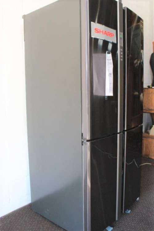 A fantastic silver front Sharp (Model SJ FP85V-BK5) 605 litre side-by-side fridge-freezer